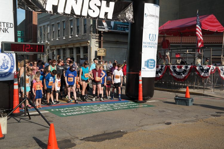 Kids Race Down Wheeling Streets